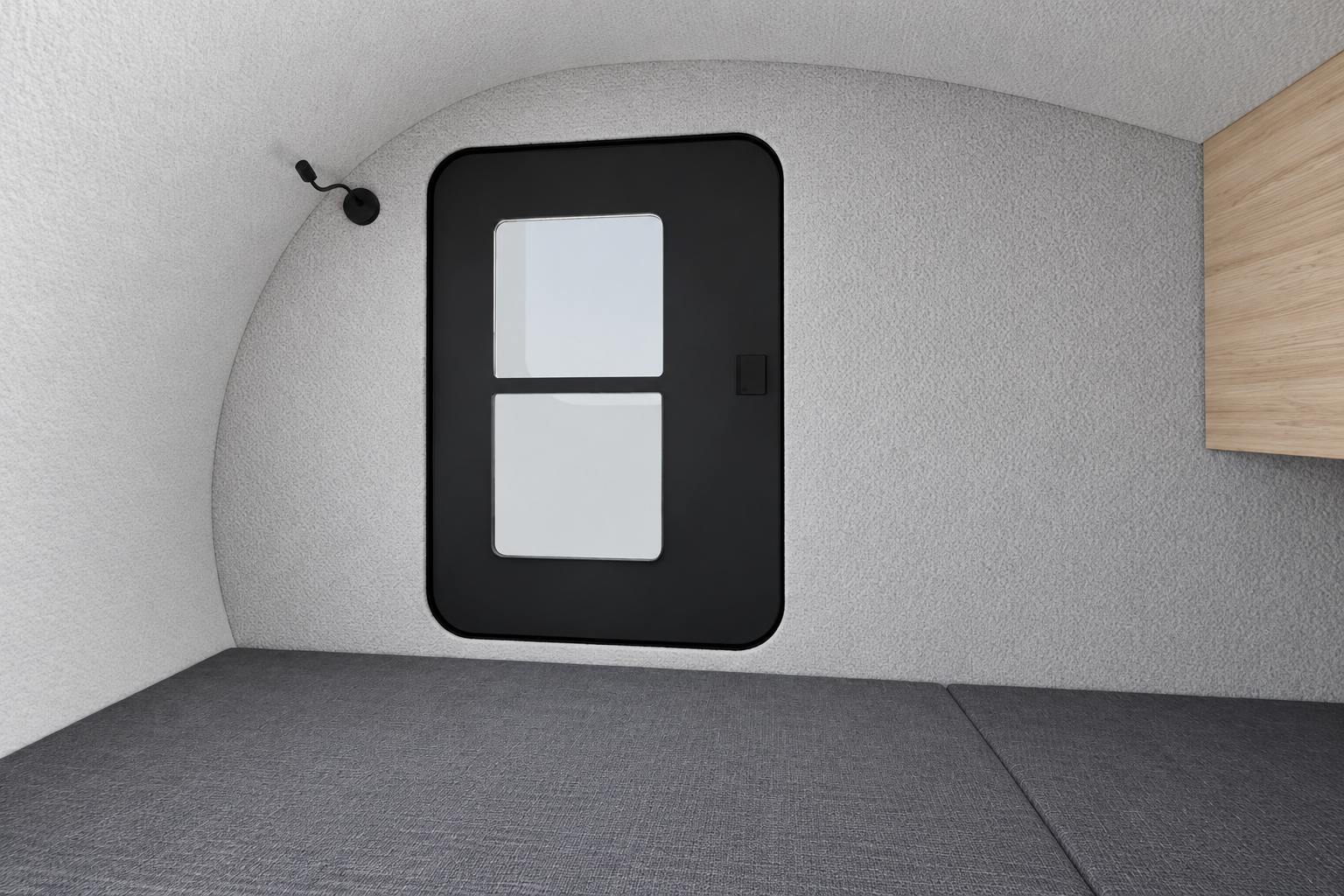 Comma CC sleeping cabin with a grey mattress and curved interior walls