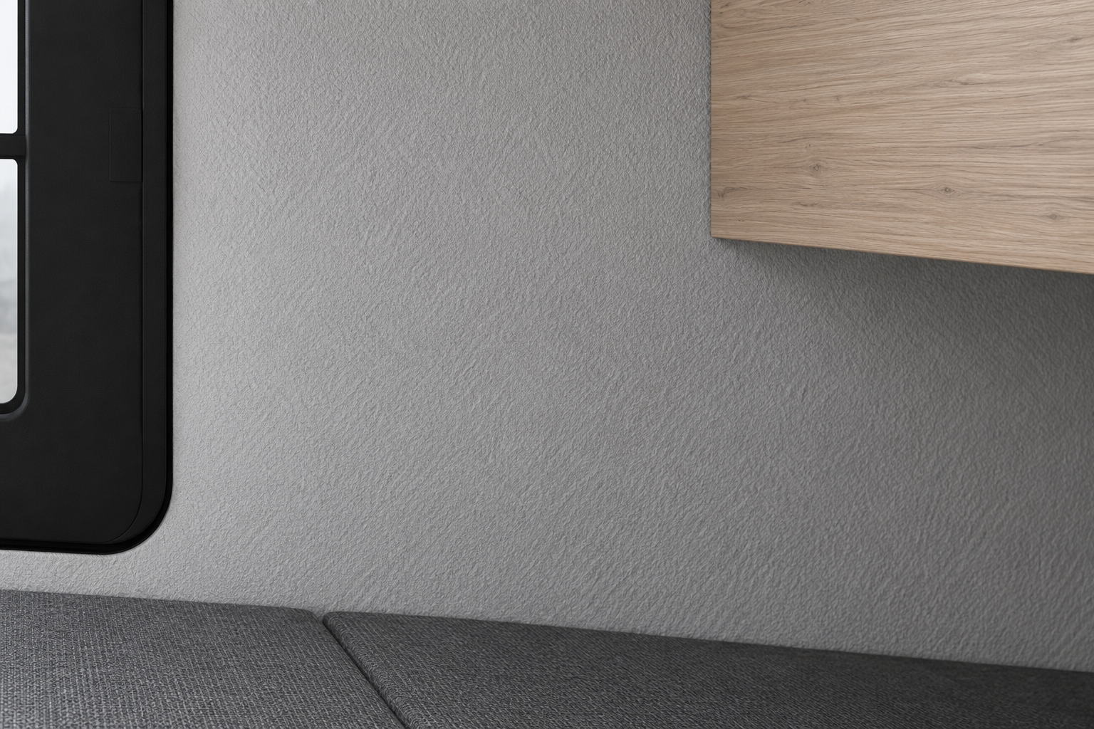 Timber-look cabinet and textured grey wall inside the Comma CC